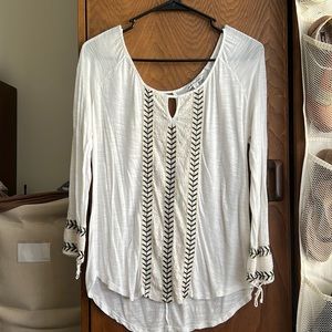 Loose white off-shoulder top
